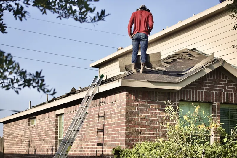 Professional roofer working on a residential roof in Downtown Hartford